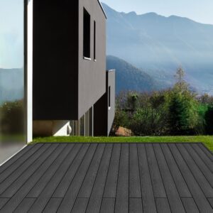 Dark grey composite deck laid outside a modern house